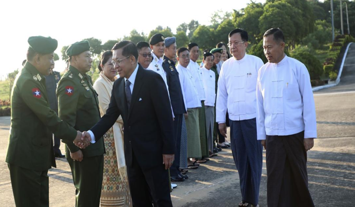 Myanmar military leader Senior Gen. Min Aung Hlaing (front right), shakes hands with a military officer while members of the State Administration Council including deputy leader Vice-Senior Gen